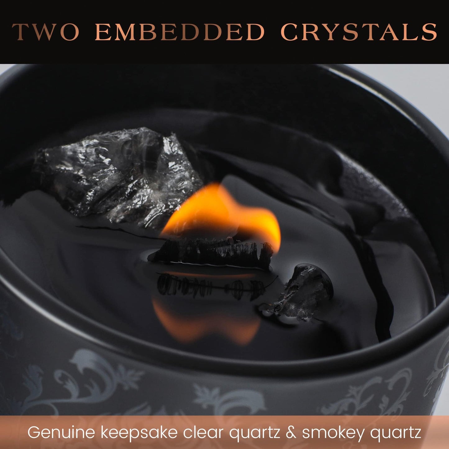 Close-up of a black candle with embedded clear quartz and smoky quartz crystals and a burning flame.